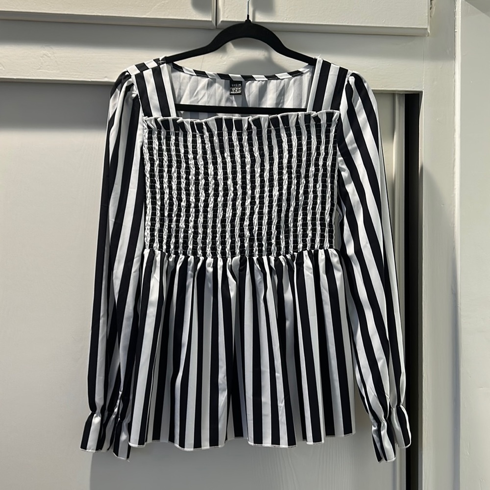 Striped, peasant style blouse….so trendy now!  Polyester and washable.